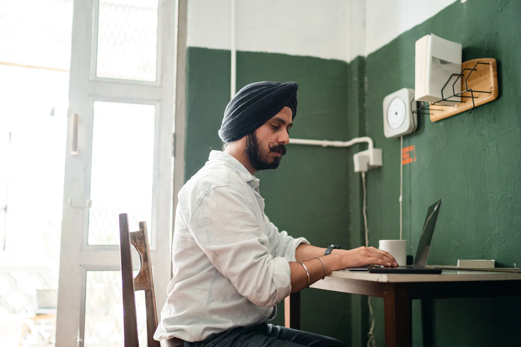 Representative professional working independently on a laptop