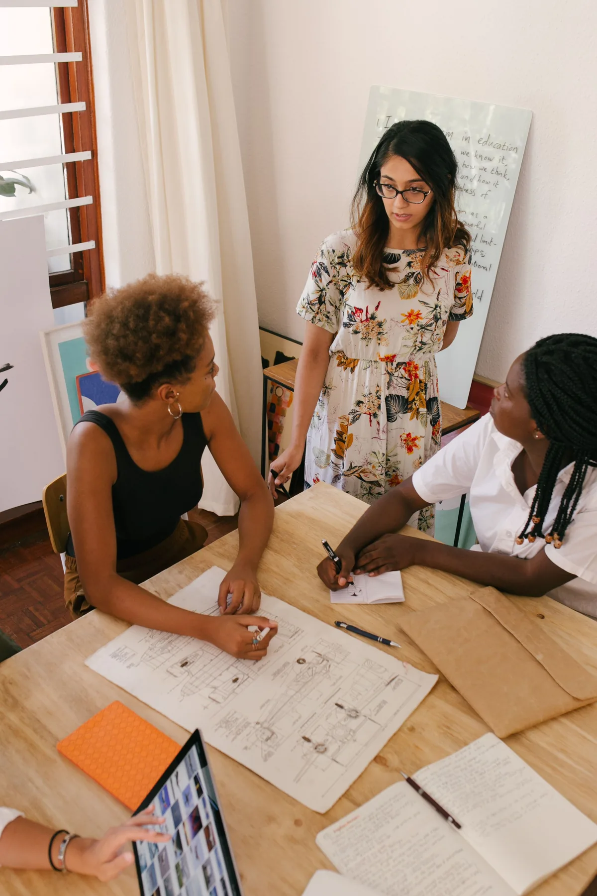 Representative women discussing a professional plan